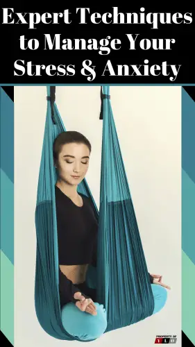 happy young woman in aerial yoga swing